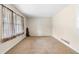 Bedroom with carpet and window overlooking the lawn at 2135 Knighton Dr, Atlanta, GA 30349