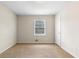 Neutral bedroom with carpet, a window offering natural light, and a closet at 2135 Knighton Dr, Atlanta, GA 30349