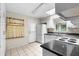 Kitchen featuring white cabinetry and appliances with adjacent dining area at 2135 Knighton Dr, Atlanta, GA 30349