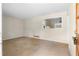 Living room featuring a kitchen view and a door to the exterior at 2135 Knighton Dr, Atlanta, GA 30349