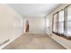 Bright living room with neutral walls, beige carpet, and plenty of natural light from a large window at 2135 Knighton Dr, Atlanta, GA 30349