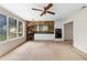 The sun room features brick accents, a ceiling fan, and many windows at 2135 Knighton Dr, Atlanta, GA 30349