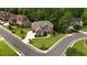 Aerial view showcasing a brick home with manicured lawn in a desirable neighborhood at 2450 Weber Heights Way, Buford, GA 30519
