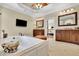 Luxurious bathroom with a jetted tub, dual vanities, and a view into an adjacent bedroom at 2450 Weber Heights Way, Buford, GA 30519