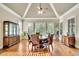 Beautiful dining room features hardwood floors, bright windows, and elegant ceiling fan at 2450 Weber Heights Way, Buford, GA 30519