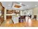 Open kitchen featuring a center island with seating, stainless appliances, and custom cabinets at 2450 Weber Heights Way, Buford, GA 30519