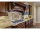 Gourmet kitchen boasts granite counters, a tile backsplash, and modern appliances for cooking at 2450 Weber Heights Way, Buford, GA 30519