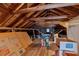 An attic featuring exposed rafters and wood flooring at 251 Beverly Ne Rd, Atlanta, GA 30309