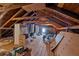 An attic featuring exposed rafters and wood flooring at 251 Beverly Ne Rd, Atlanta, GA 30309