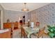 Dining room features hard wood floors, floral wallpaper, and classic light fixture at 251 Beverly Ne Rd, Atlanta, GA 30309