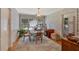 View of dining room featuring bright sunlight, hardwood floors, and classic decor at 251 Beverly Ne Rd, Atlanta, GA 30309