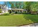 Charming single-story home with a well-manicured lawn and mature landscaping at 251 Beverly Ne Rd, Atlanta, GA 30309