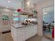 Functional kitchen with white cabinets, island cooktop, and view to dining area at 251 Beverly Ne Rd, Atlanta, GA 30309