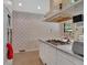 View of the kitchen featuring tile flooring, wallpaper, and stainless steel gas range at 251 Beverly Ne Rd, Atlanta, GA 30309