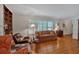 Inviting living room features hardwood floors, built-in shelving, and large window at 251 Beverly Ne Rd, Atlanta, GA 30309