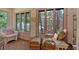 Cozy sun room with brick accents, tiled flooring, and abundant natural light at 251 Beverly Ne Rd, Atlanta, GA 30309