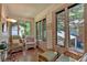Cozy sun room with brick accents, tiled flooring, and abundant natural light at 251 Beverly Ne Rd, Atlanta, GA 30309