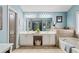 Bright bathroom featuring a double vanity, soaking tub, and tile flooring at 4434 Austin Hills Dr, Suwanee, GA 30024