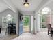 Bright foyer with a blue front door, decorative wreath, and arched windows allowing for natural light to illuminate the space at 4434 Austin Hills Dr, Suwanee, GA 30024