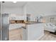 Open-concept kitchen with white cabinets, stainless steel appliances, granite counters, and view to the living area at 4434 Austin Hills Dr, Suwanee, GA 30024