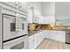 Well-equipped kitchen featuring a gas cooktop, wall oven, and stylish tile backsplash at 4434 Austin Hills Dr, Suwanee, GA 30024