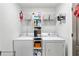 Functional laundry room featuring a side by side washer and dryer at 4434 Austin Hills Dr, Suwanee, GA 30024