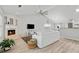 Bright living room featuring a fireplace, hardwood floors, and open access to the kitchen at 4434 Austin Hills Dr, Suwanee, GA 30024