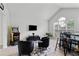 Cozy living room with vaulted ceilings, modern furniture, a sleek entertainment center, and a vintage Pac-Personal arcade game at 4434 Austin Hills Dr, Suwanee, GA 30024