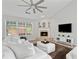 Cozy living room featuring a fireplace, hardwood floors, and lots of natural light at 4434 Austin Hills Dr, Suwanee, GA 30024