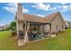Cozy outdoor patio area with a pergola, comfortable seating, and a barbecue grill for entertaining at 4434 Austin Hills Dr, Suwanee, GA 30024