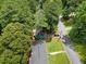 Aerial view showcasing the home's location amidst lush trees in a quiet neighborhood at 5760 Windermere Ct, Lithonia, GA 30038
