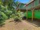 The backyard features a raised deck overlooking a verdant, partially shaded area at 5760 Windermere Ct, Lithonia, GA 30038