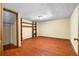 Spacious basement with hardwood floors and built-in shelving at 5760 Windermere Ct, Lithonia, GA 30038