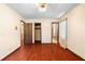 Bedroom featuring hardwood floors, and multiple entryways and a closet at 5760 Windermere Ct, Lithonia, GA 30038