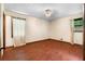 Bedroom featuring hardwood floors, a ceiling fan and a window at 5760 Windermere Ct, Lithonia, GA 30038