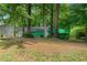 Exterior view of a home and surrounding trees, creating a private yard at 5760 Windermere Ct, Lithonia, GA 30038