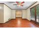 Bright living room boasts hardwood floors and a lovely view of the adjacent dining room and outdoors at 5760 Windermere Ct, Lithonia, GA 30038