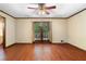 Bright living room boasts hardwood floors and a lovely view of the green outdoors at 5760 Windermere Ct, Lithonia, GA 30038