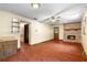 Spacious living room with hardwood floors and a brick fireplace at 5760 Windermere Ct, Lithonia, GA 30038