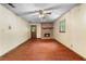 Spacious living room with hardwood floors and a brick fireplace at 5760 Windermere Ct, Lithonia, GA 30038