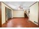Bright living room boasts hardwood floors and a lovely view of the green outdoors at 5760 Windermere Ct, Lithonia, GA 30038