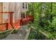 Charming backyard featuring a wood deck, stairs, and lush landscaping, perfect for outdoor entertaining and relaxation at 912 Chipley Ct, Marietta, GA 30062