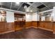 Spacious basement with hardwood floors, panelled walls and custom bar for entertaining at 912 Chipley Ct, Marietta, GA 30062