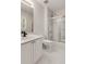 Bathroom featuring tile flooring, shower-tub combo with glass doors, and white vanity at 912 Chipley Ct, Marietta, GA 30062