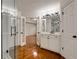 Bathroom area with enclosed shower and vanity area featuring hardwood floors and natural lighting at 912 Chipley Ct, Marietta, GA 30062