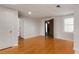 Bright bedroom with hardwood floors, neutral walls, a window, and entry doorway at 912 Chipley Ct, Marietta, GA 30062
