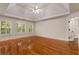 Spacious bedroom with tray ceilings, hardwood floors, and large windows at 912 Chipley Ct, Marietta, GA 30062