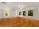 Bonus room features hardwood floors, natural light, and built-in shelving units at 912 Chipley Ct, Marietta, GA 30062