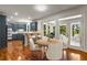 Dining area leading to a kitchen with new appliances, stone countertops and stainless fixtures at 912 Chipley Ct, Marietta, GA 30062