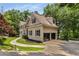 Stately home with a well-manicured lawn, a paved driveway, and a three-car garage, creating a welcoming and impressive facade at 912 Chipley Ct, Marietta, GA 30062